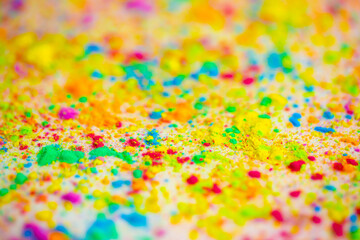 Happy Holi. A colorful festival of colored paints made from powder and dust. Colorful holi powder background. Holiday of bright colors Indian tradition.