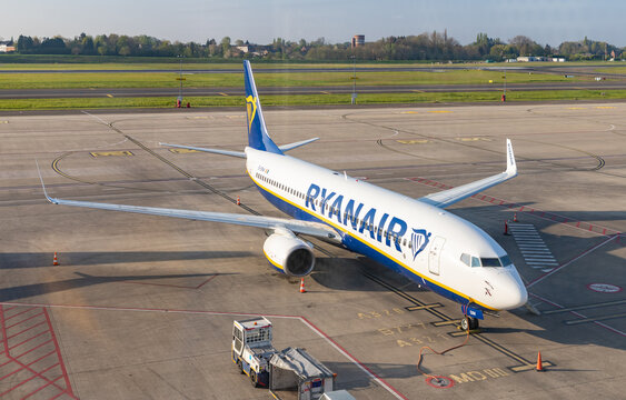 Charleroi, Belgium - April 22, 2022: A picture of a Ryanair plane parked near the terminal at the Charleroi Airport.