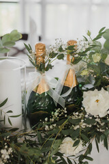 Decoration of the wedding table of the newlyweds, candles, gypsophila, eustoma, rose, eucalyptus. wedding bottles
