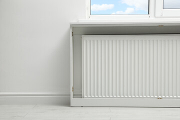 Obraz na płótnie Canvas Modern radiator at home, space for text. Central heating system