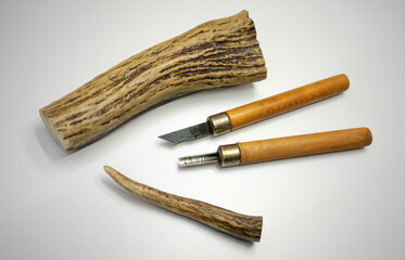 Bone carving. Chisels for carving natural horn on white isolate. Souvenirs made of horns.