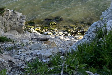 At the foot of the sea. Rocky coast. Steep rocks. Black Sea. Novorossiysk Russia.