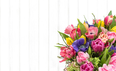 Spring tulip flowers bouquet bright wooden background