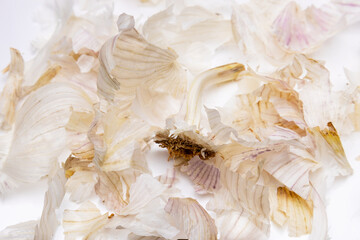 Garlic peel isolated on white background, garlic peel often used in folk medicine, healthy natural...