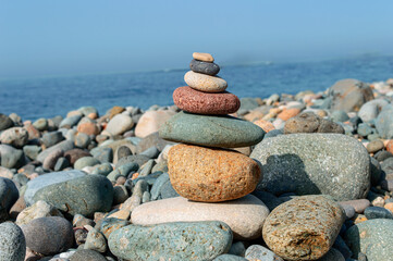 Fototapeta na wymiar Stack of stones on the sea beach.