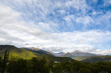 Naklejka premium Scenic Landscape of the Caucasian mountains range covered lush forest near Gremi village under amazing sky with clouds, Kakheti region, Georgia