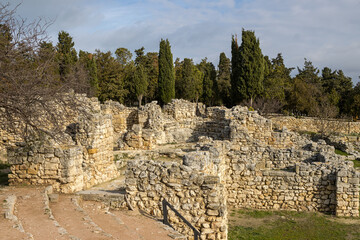 Ruins of stone buildings in the ancient city. Archaeological sites. Ruins of the ancient city of Chersonesus. Historical sights of the Crimean peninsula. Sevastopol, Crimea.