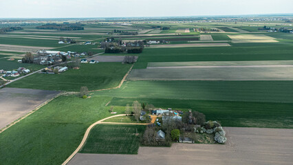 Adrone aerial view of beautiful small farms in the fields. Charming view of village environment