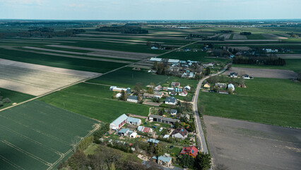 Adrone aerial view of beautiful small farms in the fields. Charming view of village environment