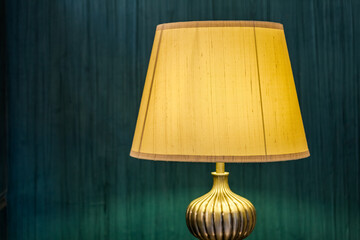 table lamp in front of modern green wall interior design
