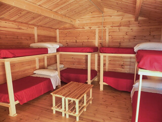 Interior of a log cabin with bunk beds - obrazy, fototapety, plakaty
