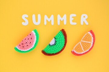 Colourful handmade slices of watermelon, kiwi, orange and lettering Summer on yellow background. Vacation creative tropical bright minimalistic food concept. Flatlay, top view holiday composition