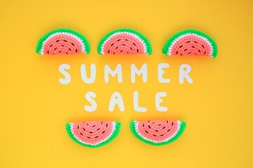 Slices of watermelon and lettering Summer sale on yellow background. Banner with percentage sign. Promotion of the poster sale or percent discount in the store. Mock up, top view, flatlay concept