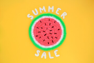 Slice of watermelon and lettering Summer sale on yellow background. Banner with percentage sign. Promotion of the poster sale or percent discount in the store. Mock up, top view, flatlay concept