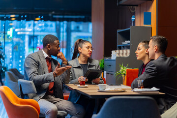 Talking about the business plans and ideas while sitting in the cafe