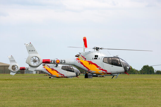 RAF Waddington, Lincolnshire, UK - July 6, 2014: Spanish Air Force (Ejrcito del Aire) Eurocopter EC-120B Colibri helicopter from the Patrulla Aspa display team performing an aerial display.