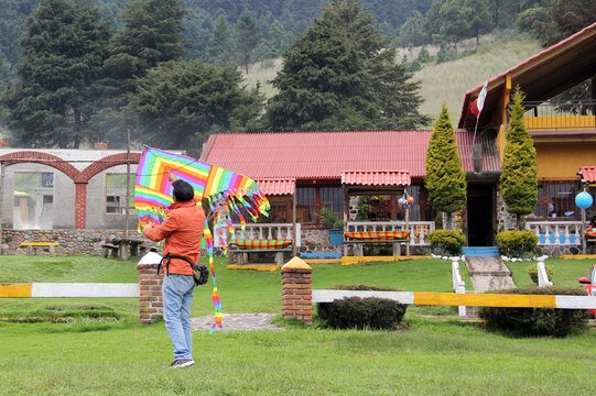 Latino Single Dad And Fat Daughter Play Fly A Kite In The Countryside Celebrating Their Love On Family Day They Exercise To Be Physically Active And Lose Weight
