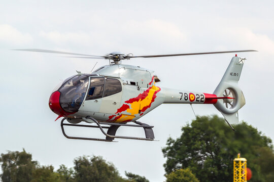 RAF Waddington, Lincolnshire, UK - July 6, 2014: Spanish Air Force Eurocopter EC-120B Colibri helicopter from the Patrulla Aspa display team performing an aerial display.