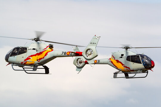 RAF Waddington, Lincolnshire, UK - July 6, 2014: Spanish Air Force Eurocopter EC-120B Colibri helicopter from the Patrulla Aspa display team performing an aerial display.