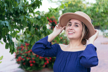 Portrait Of Beautiful Young Woman Standing Against Tree