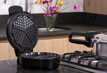modern electric waffle iron in the kitchen