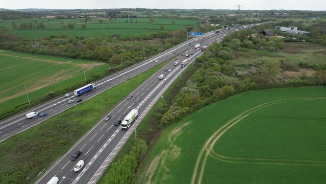 Heavy traffic on M1 Junction with London orbital M25 drone aerial view