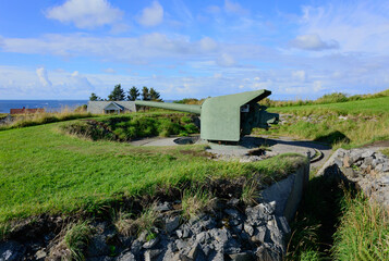 Cannon at Ergan fortress world war II open air museum in Bud, Romsdal, Norway. Blue sky with...
