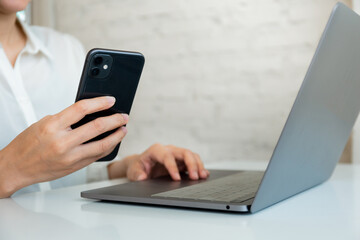 work using texting cell phone typing computer.student study education online learning.adult professional chatting on laptop,mobile contact us at Thinking business plan.connecting people concept