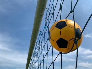 soccer ball in goal net