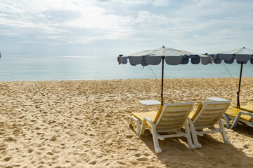Relaxing on the beach in summer sunny day, sunbed on the beach in south of Thailand, tropical island
