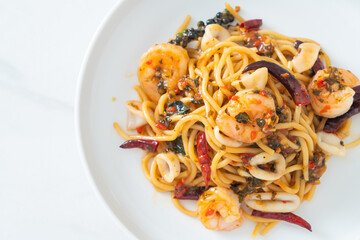 spicy spaghetti seafood on plate