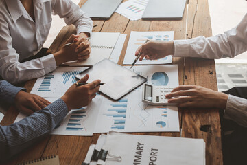Asian business adviser meeting to analyze and discuss the situation on the financial report in the meeting room.Investment Consultant,Financial Consultant,Financial advisor and accounting concept