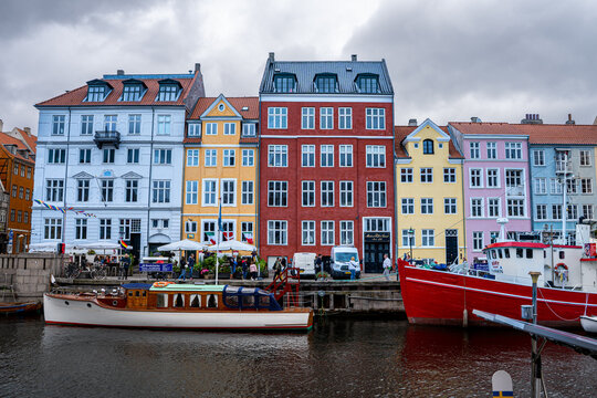 Beautiful aerial view of Nyhavn, canal and entertainment district in Copenhagen, Denmark, the harbour and the lined by brightly coloured townhouses and bars, cafes and restaurants