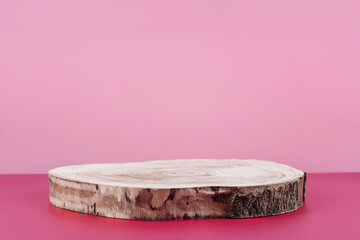 Background for cosmetic product presentation, wooden podium showcase on pink background for...