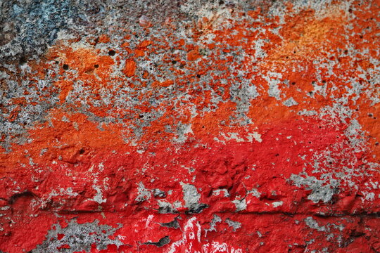 Shabby Graffiti Paint On The Concrete Wall, Colored Orange And Red Spray On The Wall, Retro Old Graffiti Wall