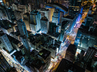 Drone fly top over Hong Kong city in Kowloon side at night