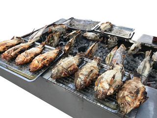 Top view of grilled tilapias on the stainless colander, focus selective