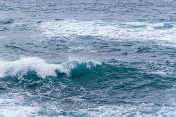 Fototapeta na wymiar Big sea wave over the harbor