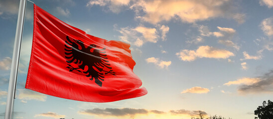 Albania national flag cloth fabric waving on the sky - Image - obrazy, fototapety, plakaty