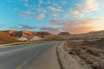 Fototapeta na wymiar beautiful road at sunset in Negev desert