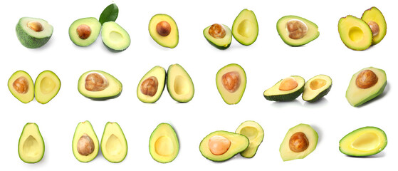 Many halves of fresh avocado isolated on white