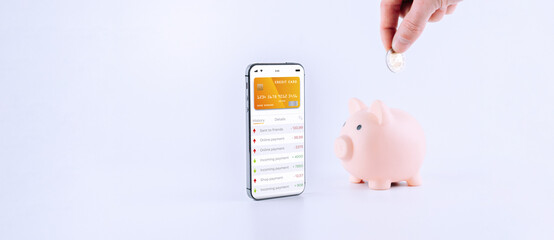 Internet based banking. Mobile phone with internet online bank app. Piggy bank with hundred dollar bill on white background. Online wallet save money.