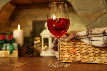Composition with glass of wine in cozy winter evening