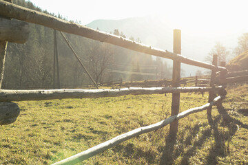 Wooden fence in Carpathian mountains in sunny day