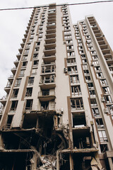 an explosion on the first floors of a high-rise apartment building. the consequences of an explosion in an apartment building. consequences after a rocket hit an apartment building.