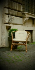 Fototapeta na wymiar white armchair on the street