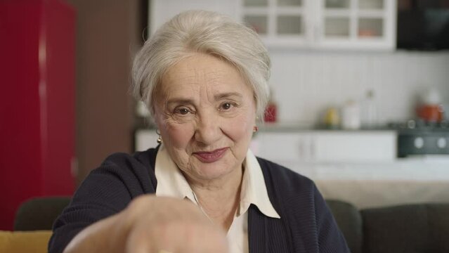 Portrait of human hand showing to camera.The old woman extending her hand to kiss her visitors during the feast (Ramadan or Şeker Bayram). People who adhere to Muslim traditions.
