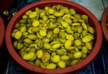 Pickled fruits in plastic bins are sold in the municipal market, Sriracha District, Thailand.