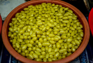 Pickled fruits in plastic bins are sold in the municipal market, Sriracha District, Thailand.