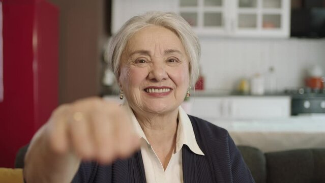 Portrait of human hand showing to camera.The old woman extending her hand to kiss her visitors during the feast (Ramadan or Şeker Bayram). People who adhere to Muslim traditions.